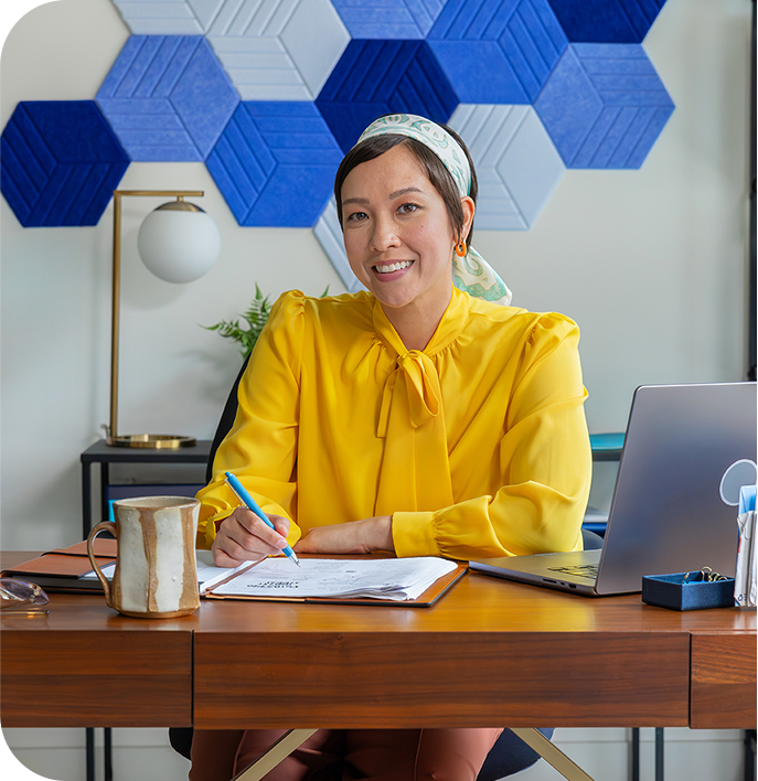 Woman Smiling at office desk