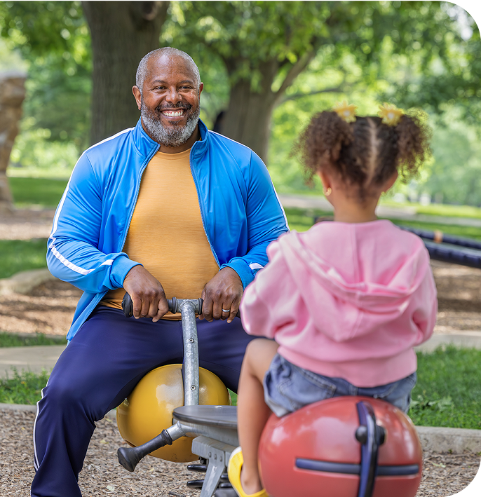 Man playing with grand daughter